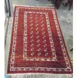 Eastern wool rug, decorated with geometric designs in green,