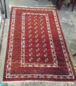 Eastern wool rug, decorated with geometric designs in green,