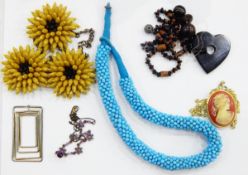 Large quantity of costume jewellery including a flowerhead necklace, bead necklaces,