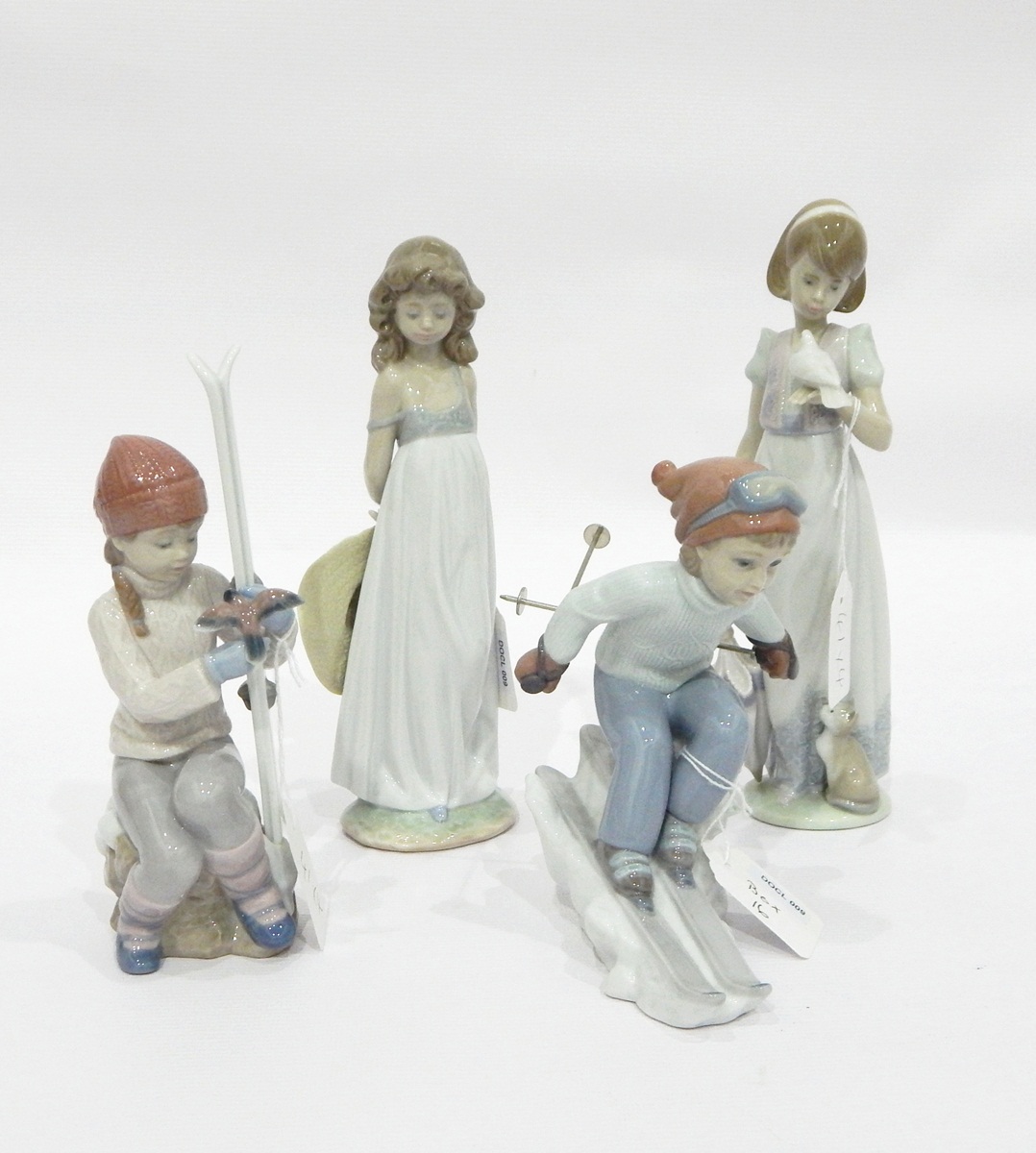 Collection of Lladro to include girl skiing, another girl holding skis with bird on hand,