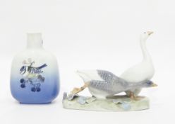 Two Royal Copenhagen items including a model group of two geese and a bottle vase with raised