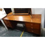 Circa 1970's teak kneehole dressing table,