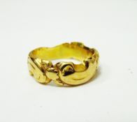 19th century gold-coloured band ring of scrolling design,