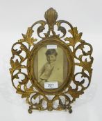 Gilt metal oval photograph frame with foliate pierced frame