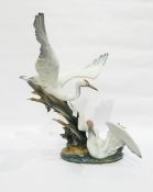 Large Lladro model of cranes swimming amongst reeds,