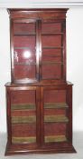 19th century cross-banded mahogany bookcase/display cabinet enclosed by two glass panelled doors