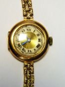 Lady's early 20th century gold coloured watch with circular dial,