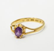 22ct gold amethyst ring set with a central oval mix cut amethyst (misshapen)