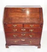 Late 18th century oak bureau, the fitted interior with arcaded pigeonholes and eight small drawers,
