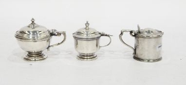 Three silver mustard pots, one by Charles & Richard Comyns, London 1922,