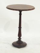 Victorian mahogany lamp table, of circular form on baluster stem on circular base,