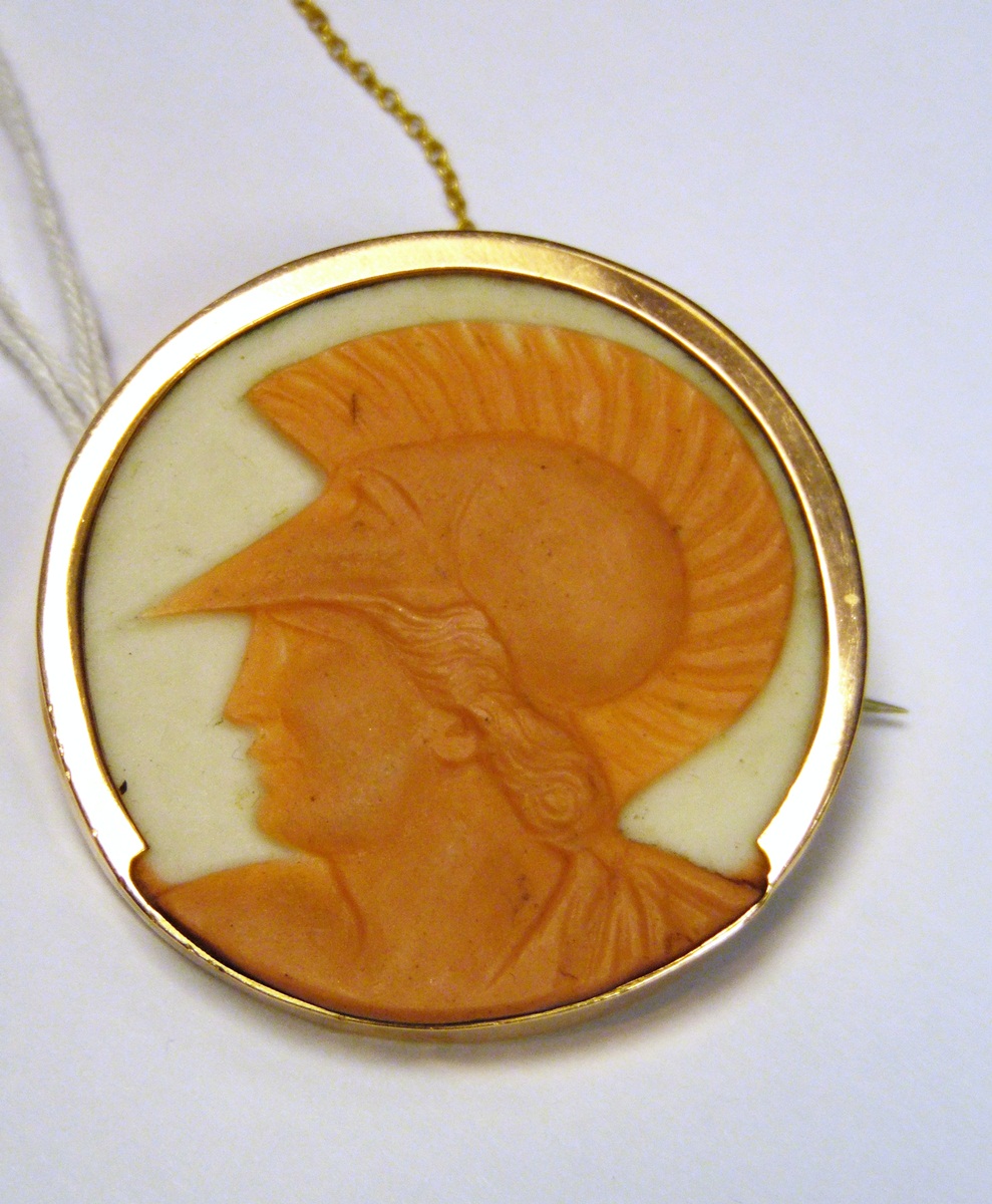 9ct gold and porcelain cameo portrait brooch, in the form of a Roman centurion's head, circular,