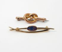 Victorian gold coloured bar brooch, knot design marked 9ct in fitted case,