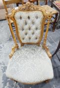 Late Victorian lady's nursing/salon chair having button upholstered shield-shaped back flanked by
