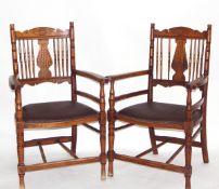 Pair of early 20th century beech and oak elbow chairs,