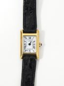 Lady's Raymond Weil gold plated strap watch, the rectangular dial with Roman numerals,