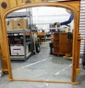 Pine overmantel mirror of rectangular form with arched top,