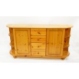 Modern pine dwarf bull-nosed side cabinet incorporating four drawers and two cupboards,