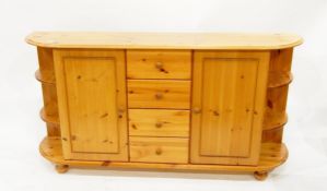 Modern pine dwarf bull-nosed side cabinet incorporating four drawers and two cupboards,