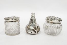 Glass scent bottle of bulbous form with silver-coloured metal overlay, in the form of irises,