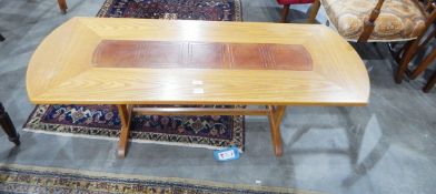 Modern oak coffee table with a tooled leather inset top,