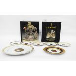 Quantity of collector's china plates depicting Faberge eggs and two hardback copies of Lladro "The