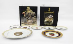 Quantity of collector's china plates depicting Faberge eggs and two hardback copies of Lladro "The