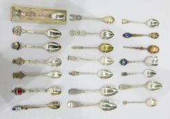 Three Georgian silver teaspoons and a collection of silver and silver plated souvenir spoons