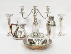 Silver plated three-branch candelabrum, a silver plated cocktail shaker,