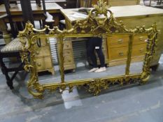 Carved giltwood overmantel wall mirror, rectangular and in three sections,