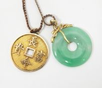 Chinese gold-coloured disc pendant, decorated with characters, marked 14K and 585, approx.5.