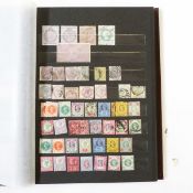 Brown stock book and contents of GB stamps including 2/-blue 118, 2 x 8d 156, 5/- rose SG127,