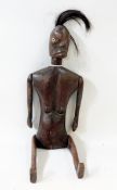 Carved hardwood articulated tribal figure, possibility an Indonesian fertility doll, the female