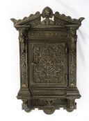 Victorian cast iron & wood key cabinet with mask and scroll triangular pediment, ornate strapwork