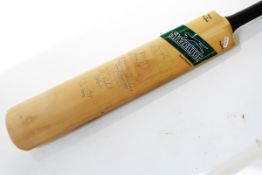 Miniature Nicolls Crusader cricket bat with facsimile signatures for the 1954 Pakistan team, another
