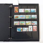 Four albums and contents of mint stamps (most unmounted), including Australia, New Zealand, Fiji,
