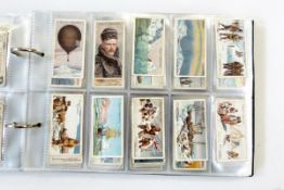Two albums and contents of cigarette cards including 23 of 50 from a set of Ringer's cigarettes of