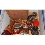 Assorted carved wooden items, seashells, a vintage baby's musical box,