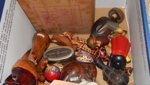 Assorted carved wooden items, seashells, a vintage baby's musical box,