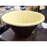 Large ceramic dairy bowl with yellow glazed interior