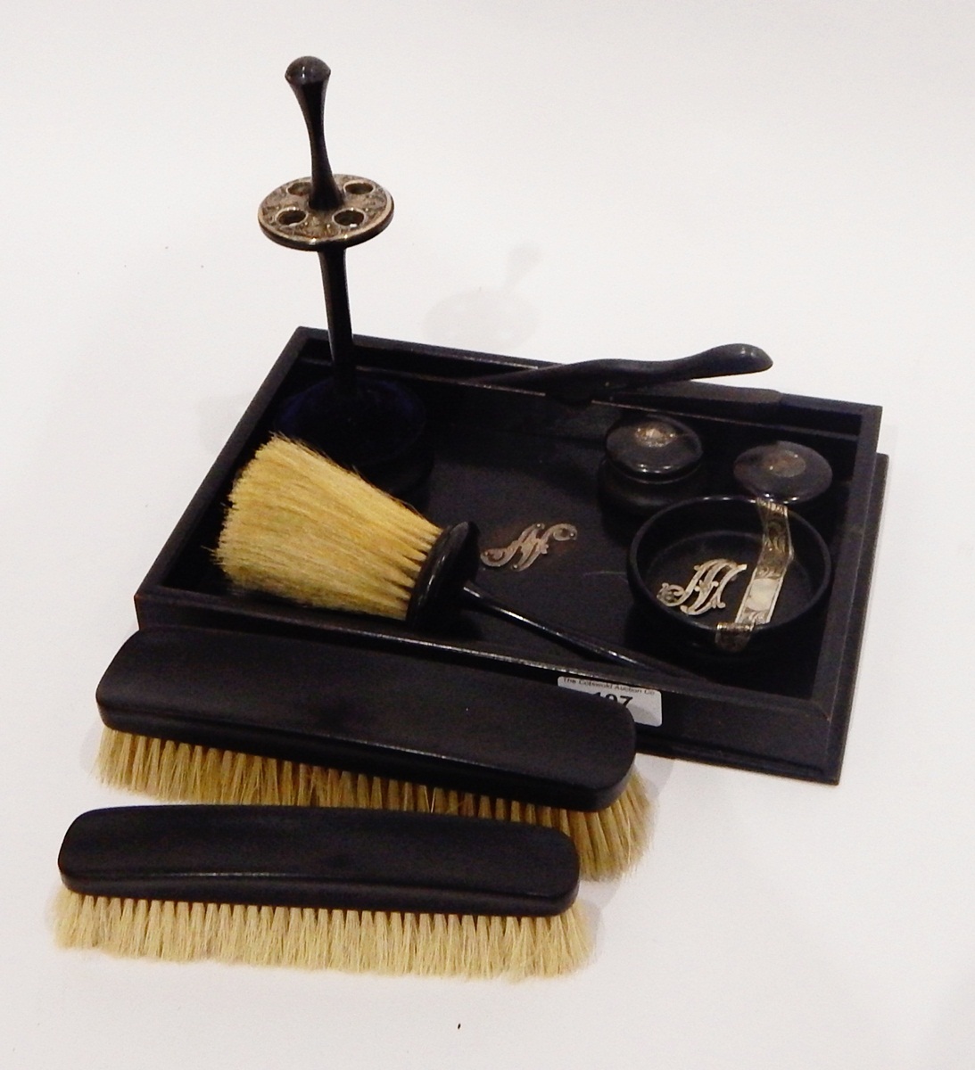 Ebony and silver-mounted dressing set and tray with initial 'N', comprising of brushes,