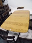 Ercol-style light elm extending dining table