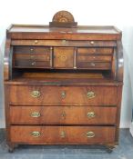 19th century Continental mahogany cylinder bureau, the roll-top revealing a fitted interior,