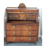 19th century Continental mahogany cylinder bureau, the roll-top revealing a fitted interior,
