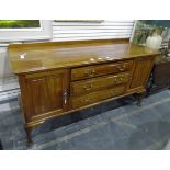 20th century mahogany sideboard having three long central drawers flanked by cupboards,