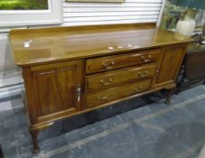 20th century mahogany sideboard having three long central drawers flanked by cupboards,