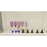 Quantity of drinking glasses including a set of five purple wine glasses with gilt decoration,