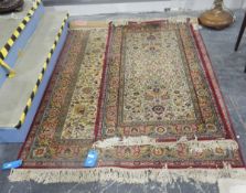 Persian wool rug, the cream ground with stylised foliate decoration, red and green border,