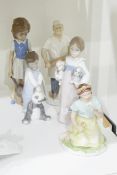 Lladro figure of a little girl holding two puppies,