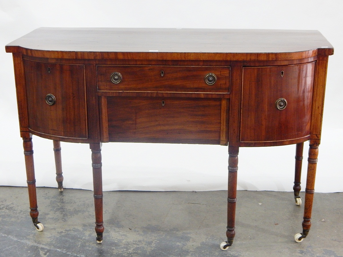 19th century mahogany bowfront sideboard with central frieze drawer and deep apron drawer below,